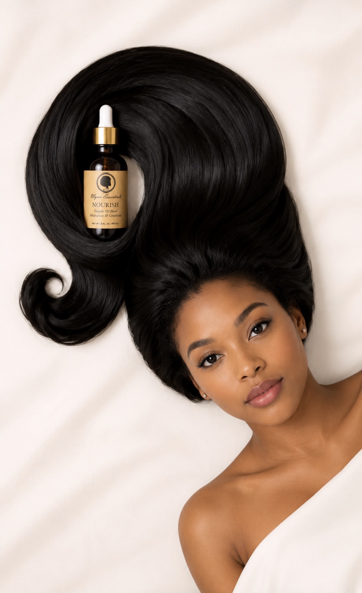 Model with long, glossy hair styled around Wynn Essentials Nourish Oil