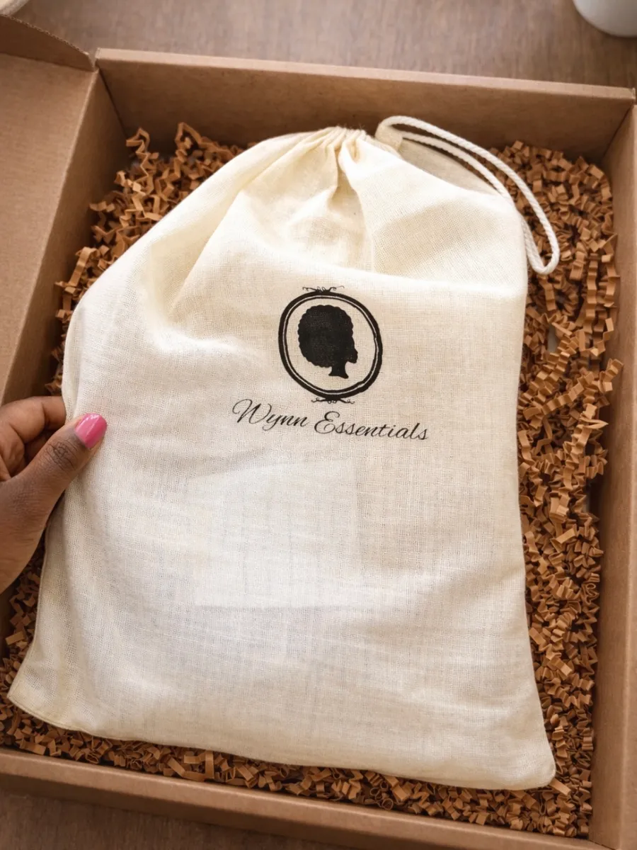 Wynn Essentials linen drawstring pouch in a kraft gift box